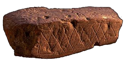 Kuva vaaleasta tasaisesta kivestä, jonka pinnassa viivakuvioita
